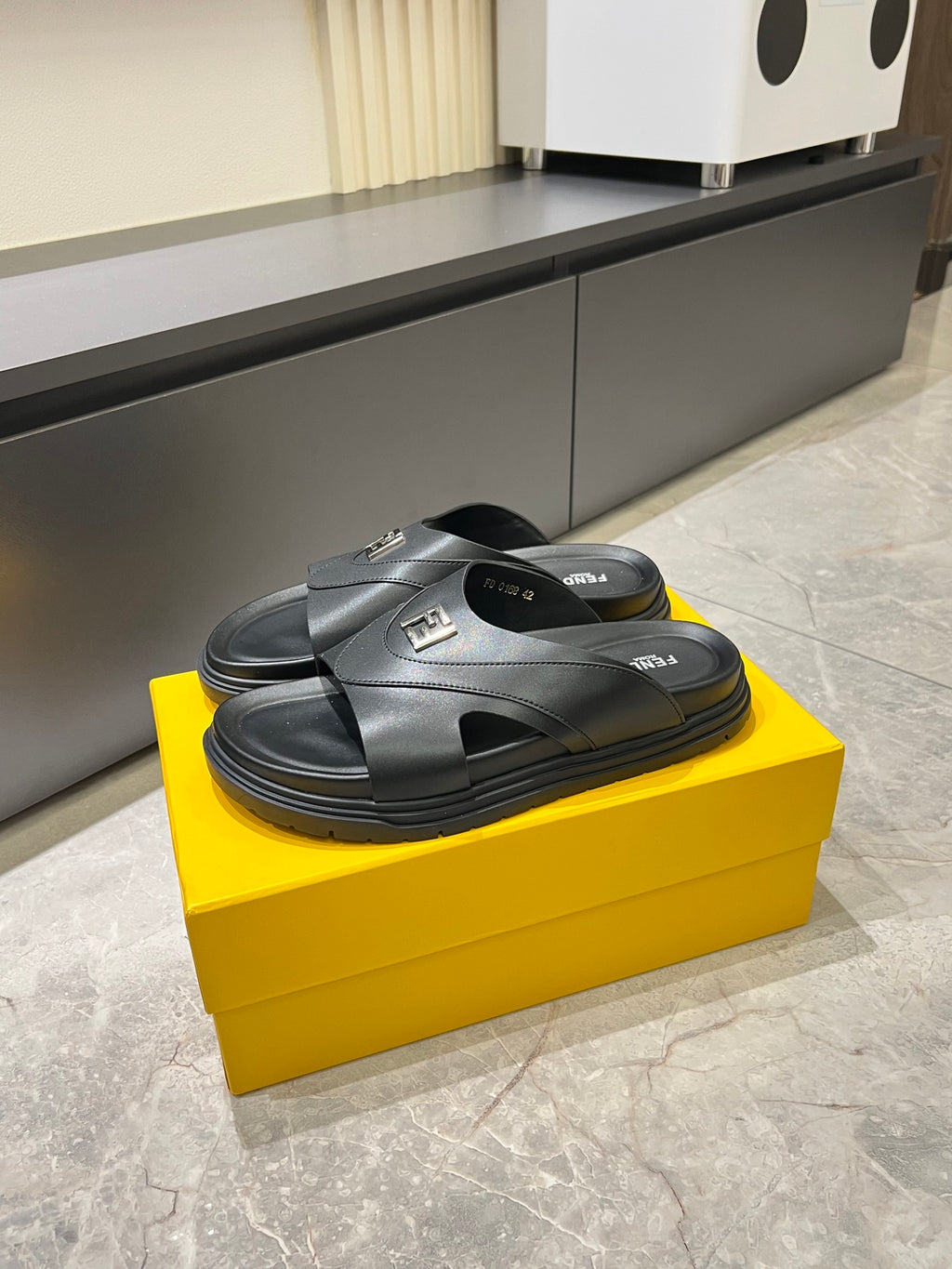 Fendi black leather-look slide sandals with cross straps and FF logo