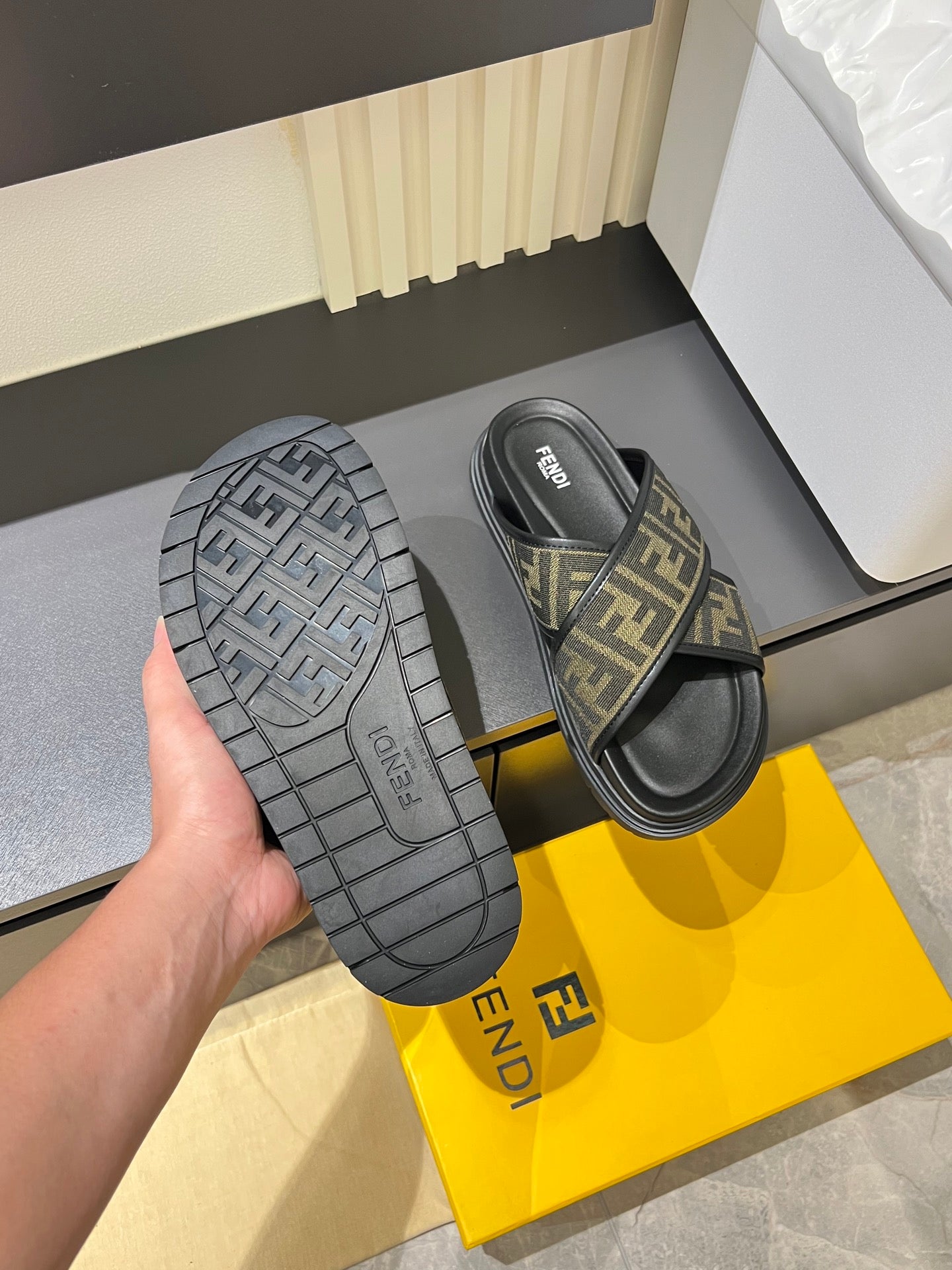 Fendi slide sandals with textured tread sole and FF monogram strap