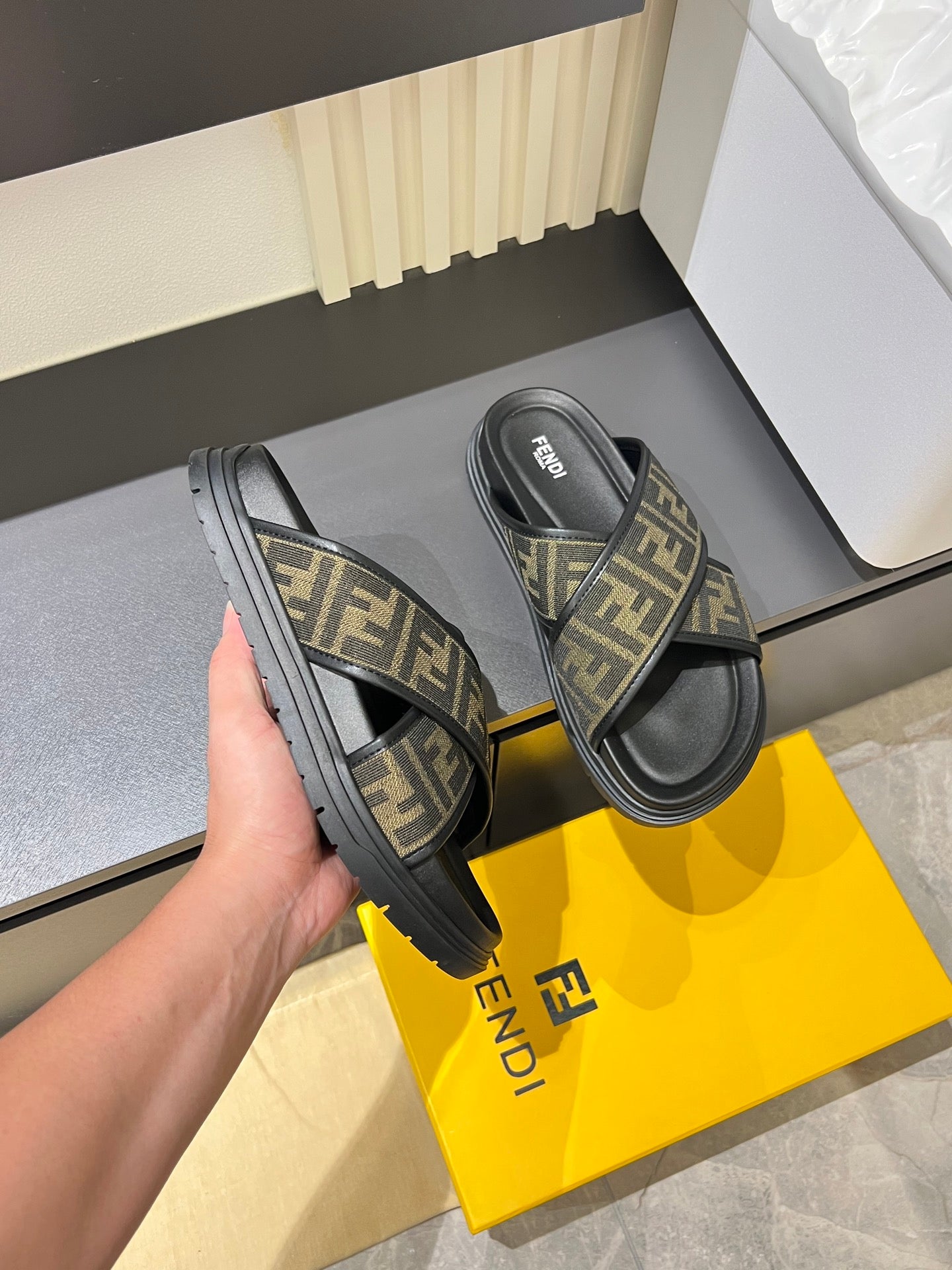 Fendi slide sandals with FF monogram straps and treaded black sole