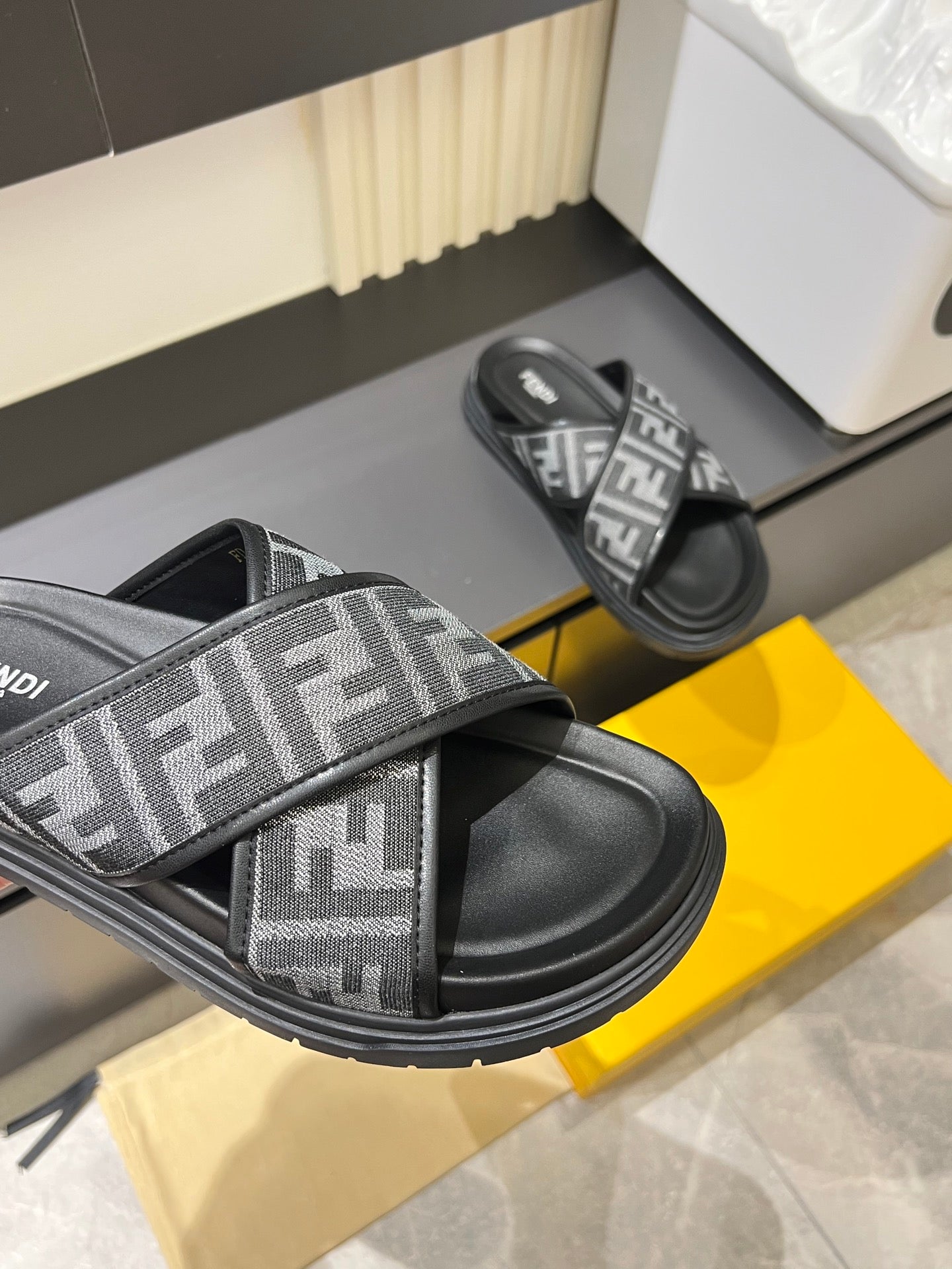 Fendi FF slide sandal close-up with wide strap and textured rubber sole