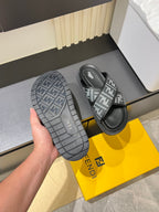 Fendi FF slide sandals, outsole tread view and black footbed