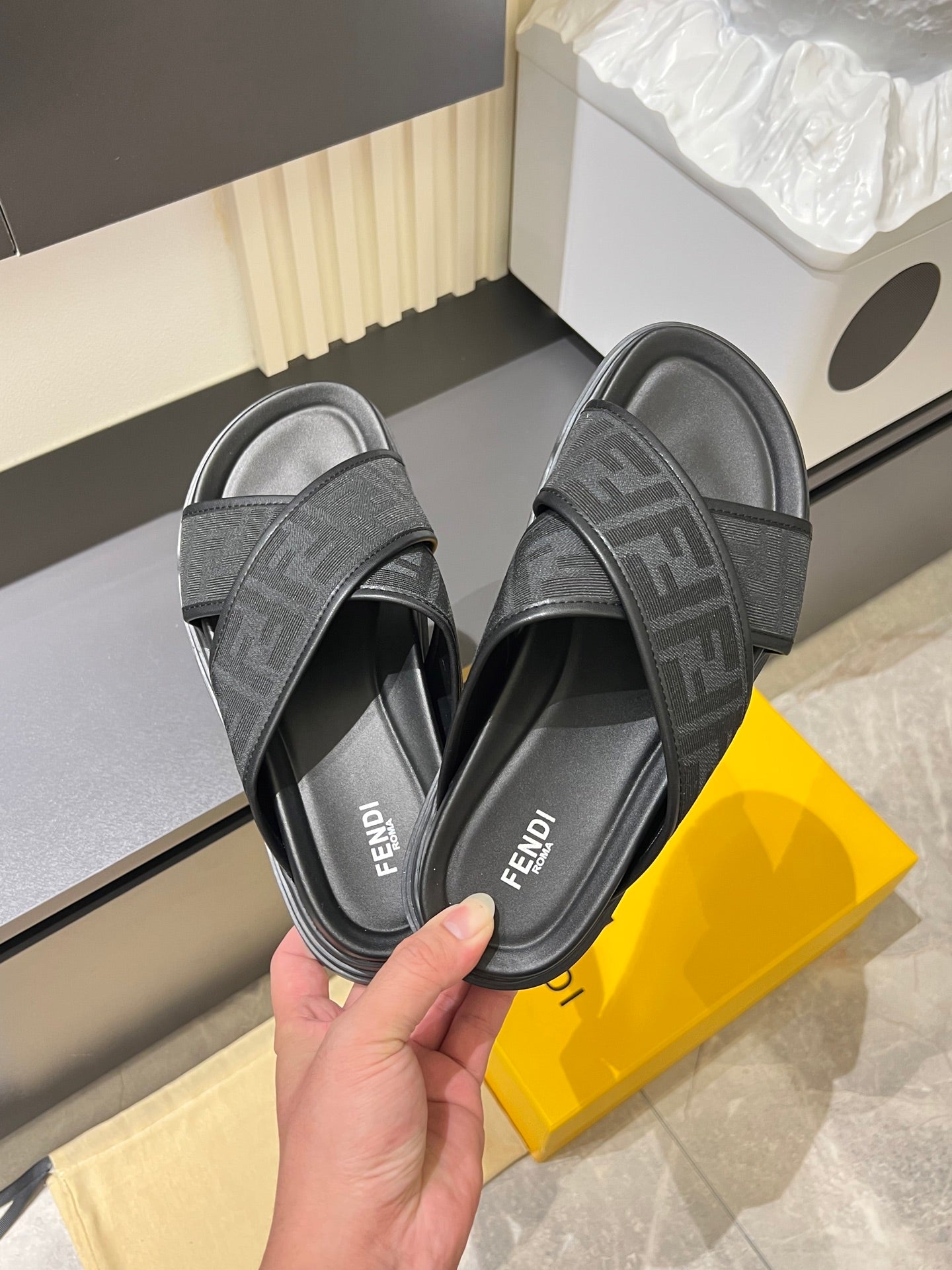 Gray slide sandals with F-style logo straps and cushioned sole