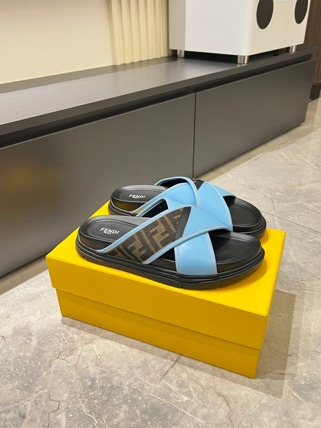 Fendi slide sandals, light blue straps over dark footbeds with FF monogram panels
