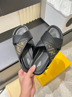 Fendi black slide sandals with FF-logo strap panels and cushioned footbed