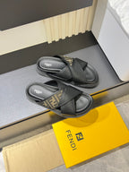 Fendi black leather slide sandals with crossed straps and FF monogram inlay
