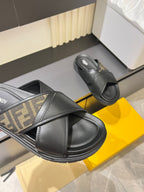 Fendi black slide sandals with FF logo strap detail and wide crossover band