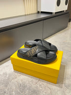 Fendi black slide sandals with crisscross straps and FF monogram trim