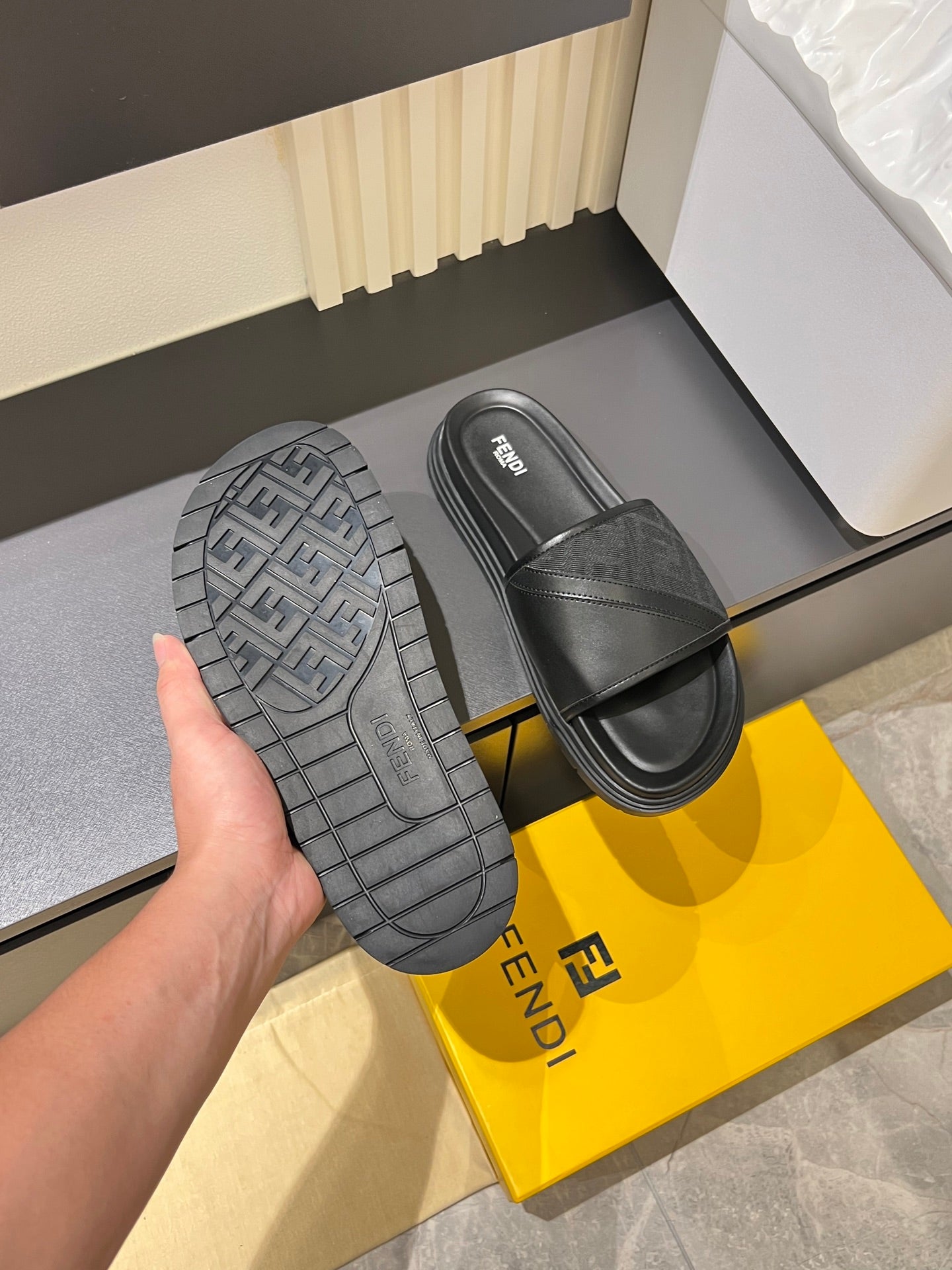 Fendi dark gray slide sandals with treaded outsole and wide strap