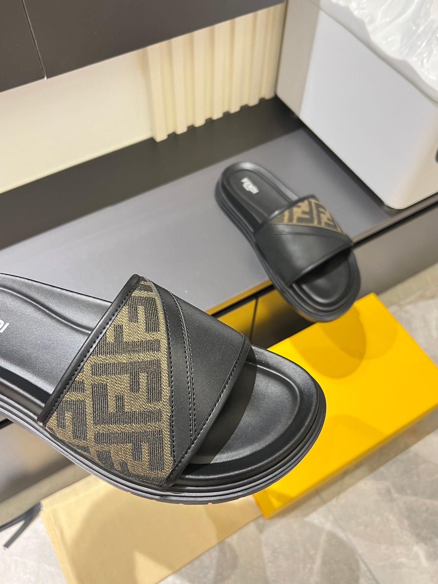 Fendi slide sandal with FF monogram strap and black rubber sole