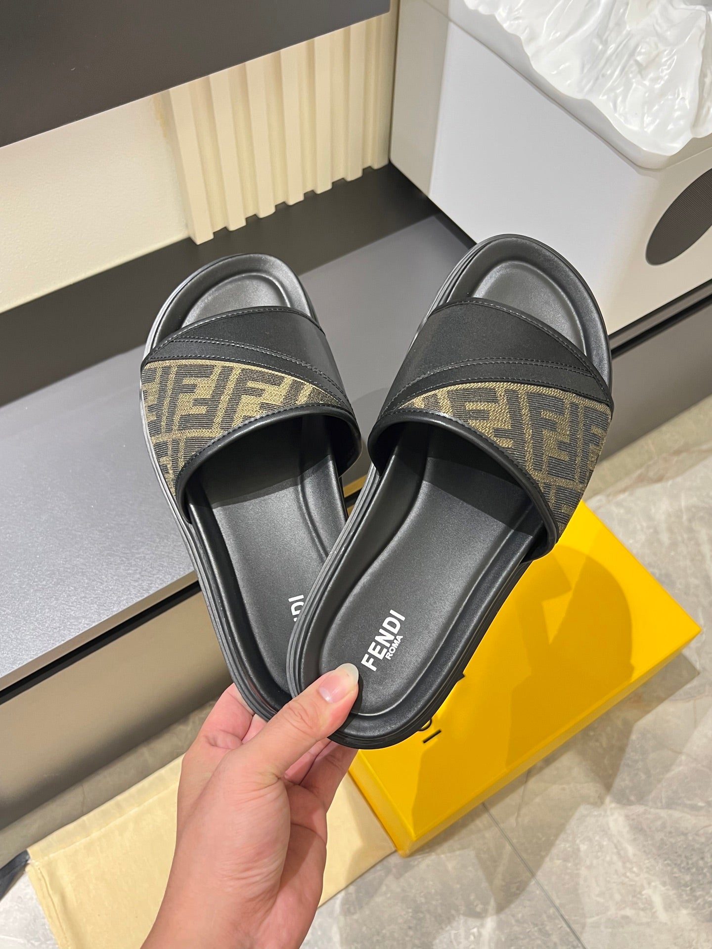 Fendi slide sandal, black leather with FF monogram straps at top