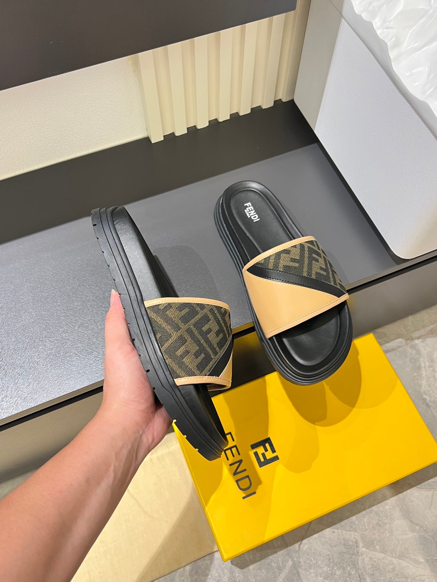 Fendi slide sandals, dark sole with tan FF logo strap and tan foot strap edge