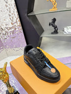 Black lace-up sneaker with embossed upper texture and logo patch on side