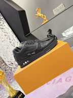 Black lace-up sneakers with embossed logo detailing and patterned side panel design