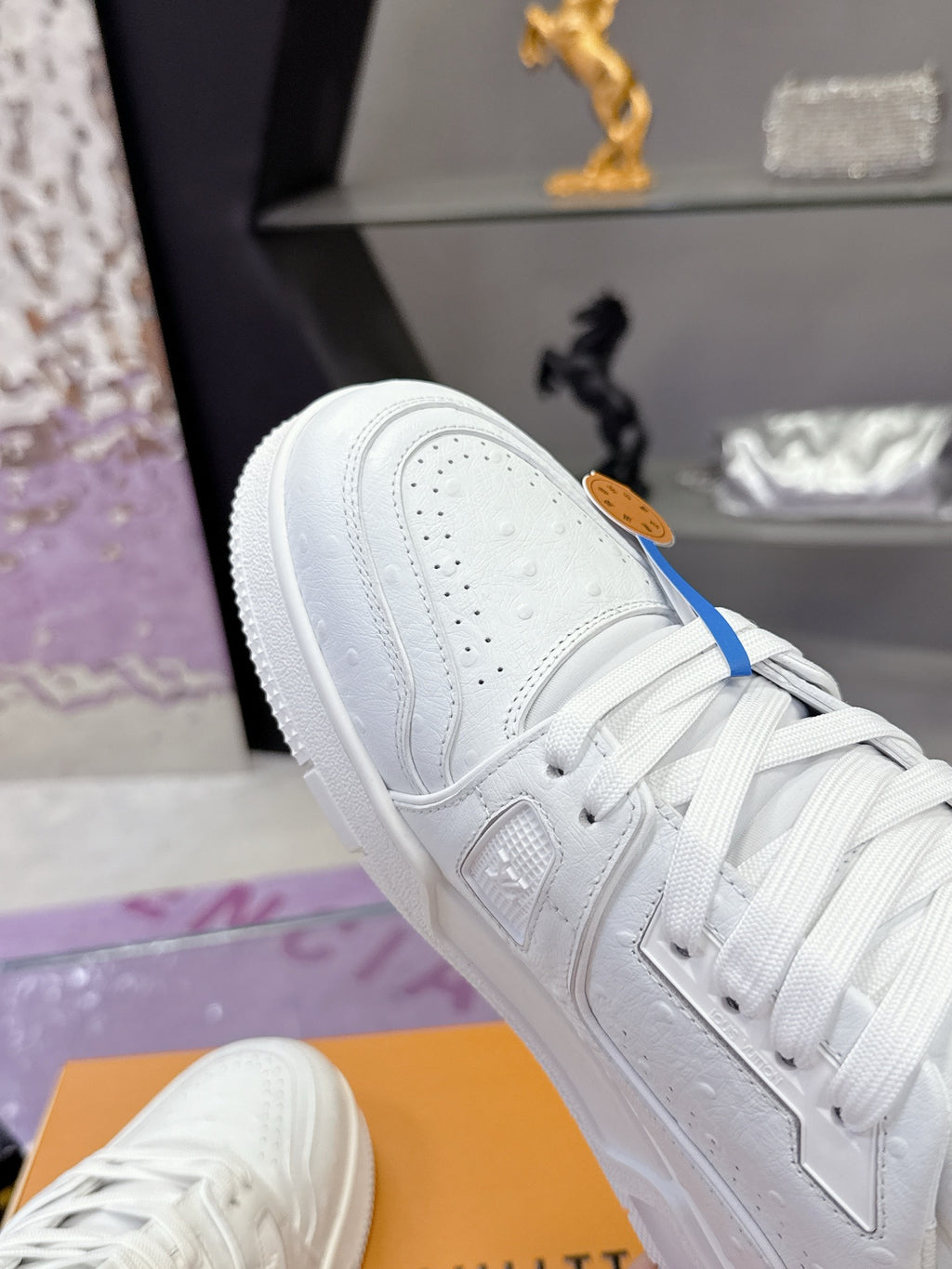 Louis Vuitton white lace-up sneakers with blue side stripe and perforated toe panel