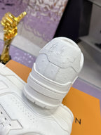 Louis Vuitton white sneaker heel strap with embossed emblem, thick cushioned sole