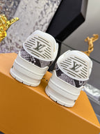 Back view of white Louis Vuitton sneakers showing logo heel details and tread