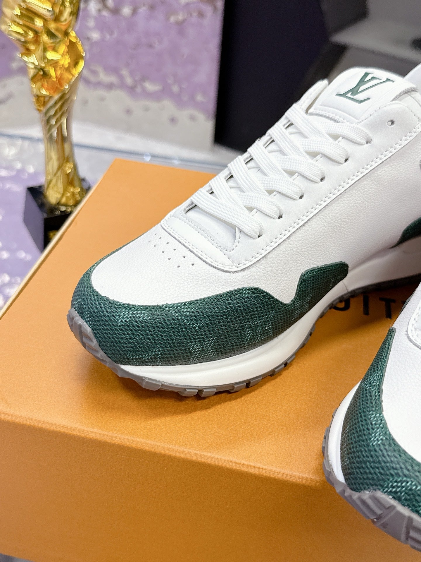 White and green lace-up sneaker with green toe and textured sole