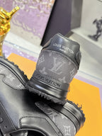 Louis Vuitton sneakers heel close-up with Louis Vuitton text, dark gray/black