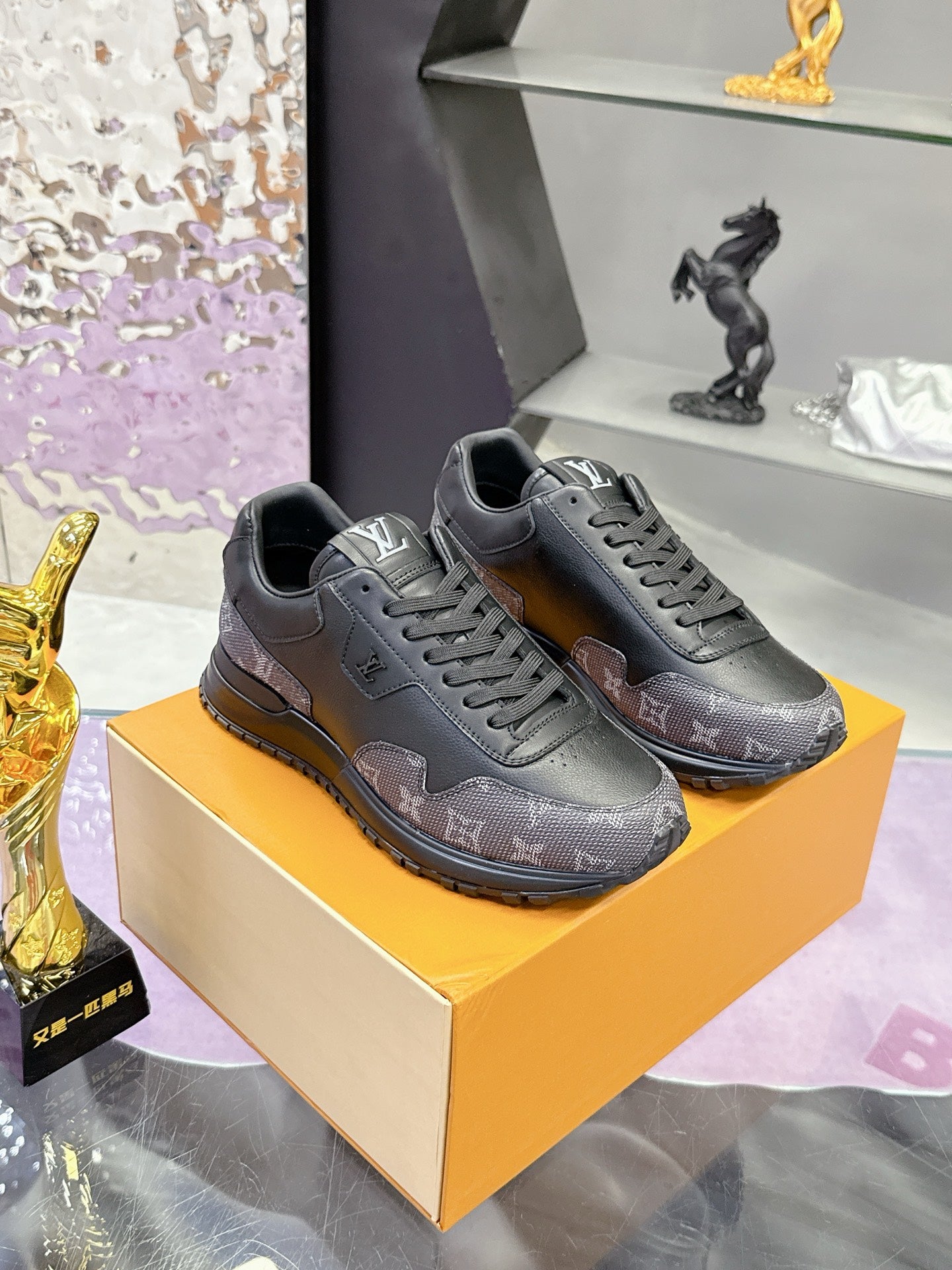Louis Vuitton lace-up sneakers, dark gray/black with repeating logo pattern on box
