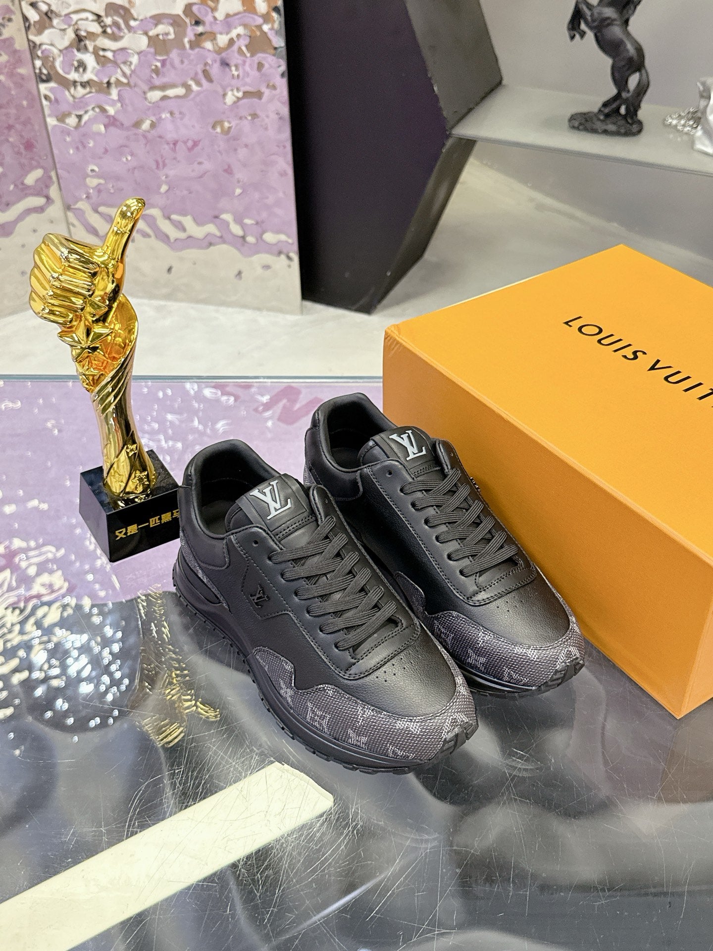 Louis Vuitton low-top sneakers in dark gray/black monogram, pair displayed on box