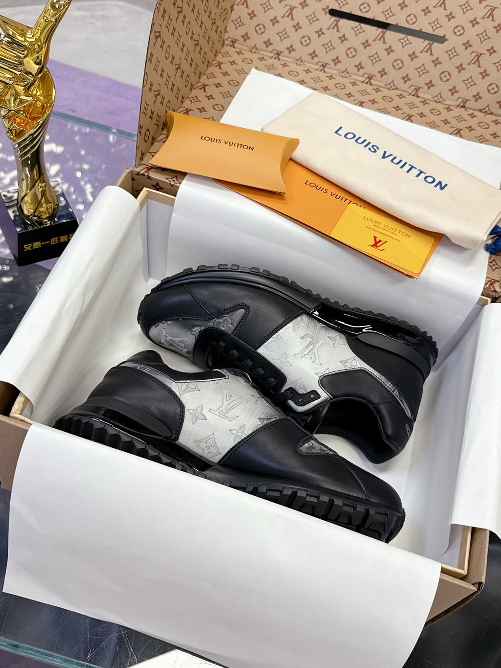 Louis Vuitton ladies sneakers, dark leather with silver patterned panels, lace-up.