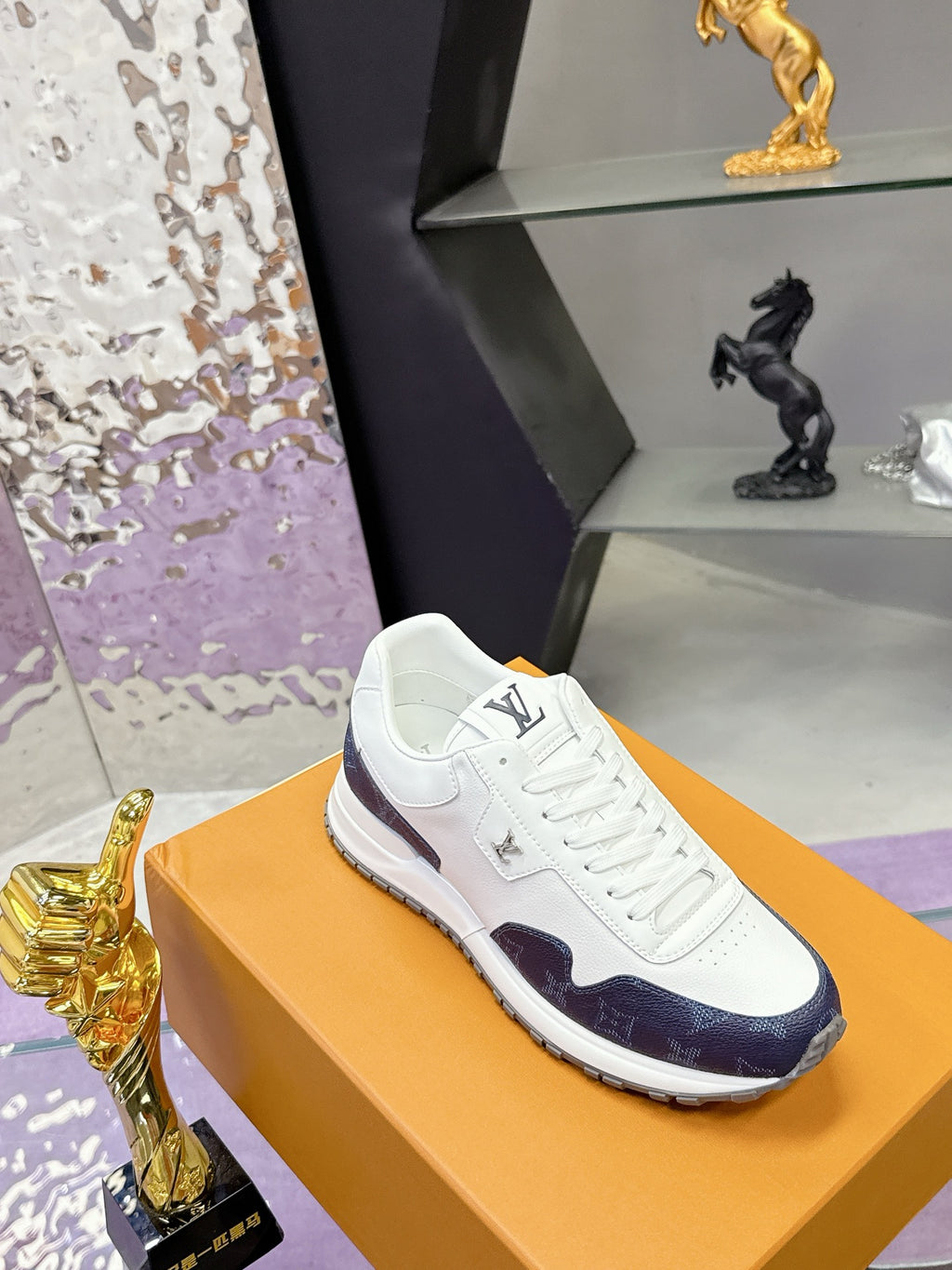 Louis Vuitton ladies sneakers, white leather with navy monogram side panel and laced front