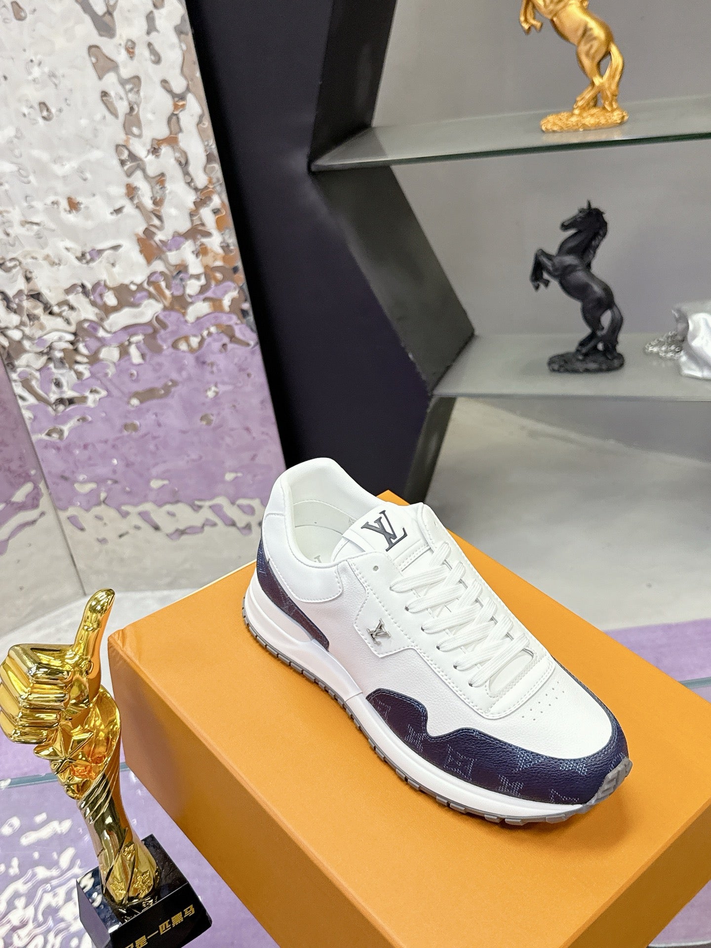 Louis Vuitton ladies sneakers, white leather with navy monogram side panel and laced front