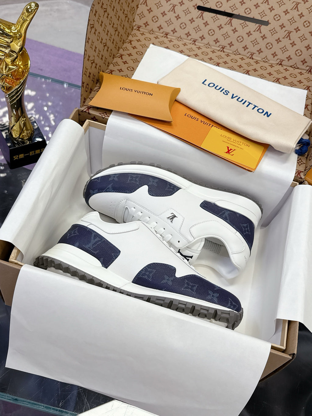 Louis Vuitton ladies sneakers, white leather with navy monogram side panels and logo tongue