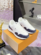 Louis Vuitton ladies lace-up sneakers on box, white with navy monogram quarter panels