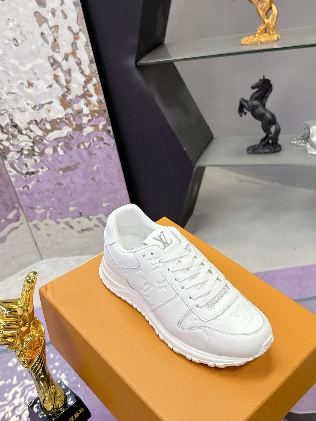 White women's lace-up sneakers with monogram side detail and textured rubber sole