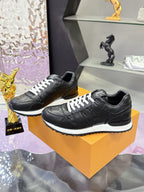 Louis Vuitton black leather sneakers, lace-up style with white tread sole
