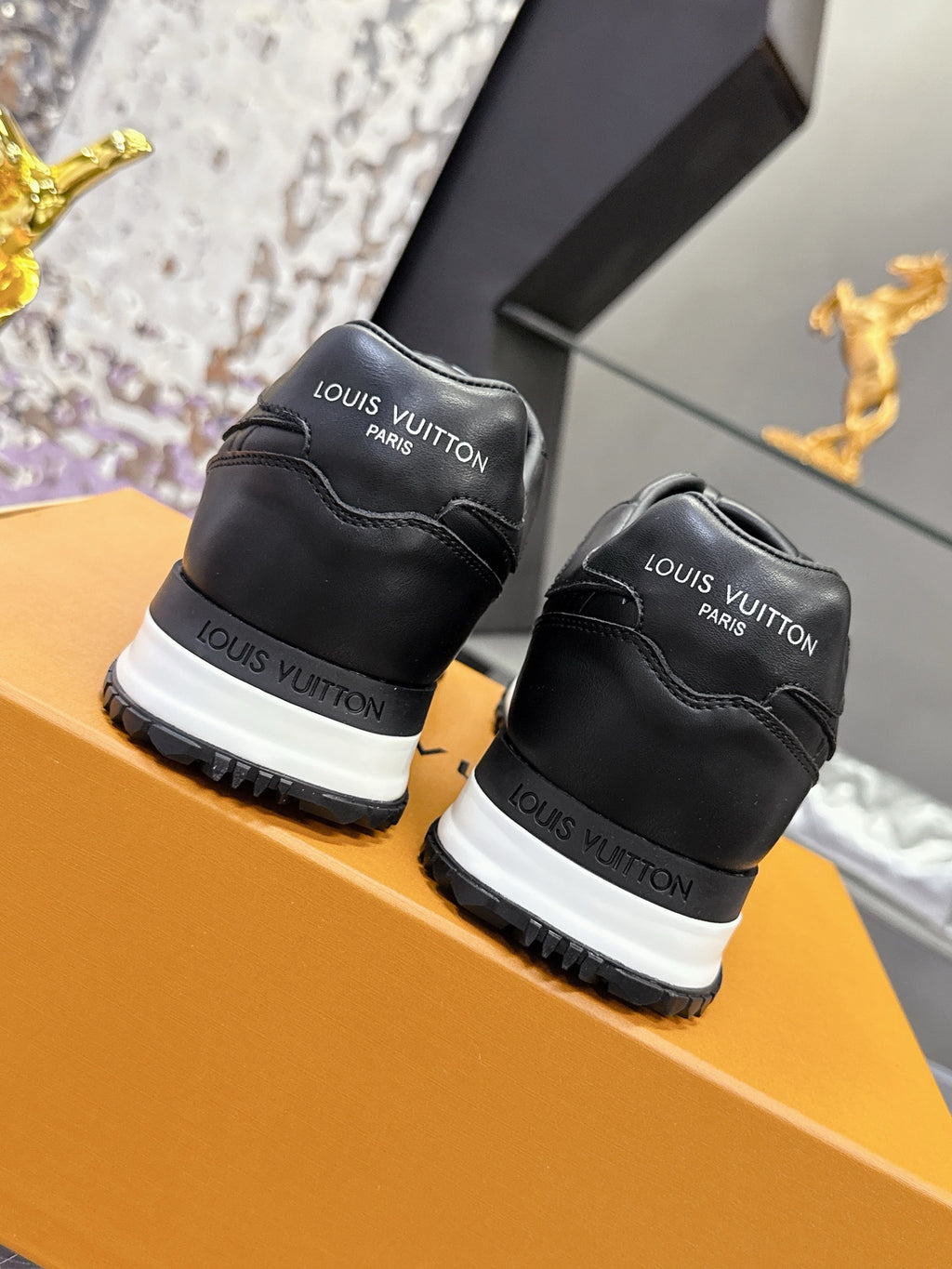 Louis Vuitton black sneakers pair view, lace-up with white rubber outsoles