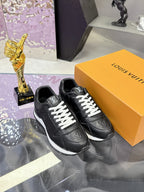 Louis Vuitton black sneakers with monogram detail, white laces and striped sole