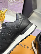 Louis Vuitton black sneaker side view, embossed pattern and white sole