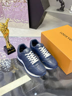 Blue leather low-top sneakers with LV logo detail, white laces and white-blue sole.