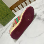 Gucci unisex sneaker outsole, textured dark red with embossed logo and emblem