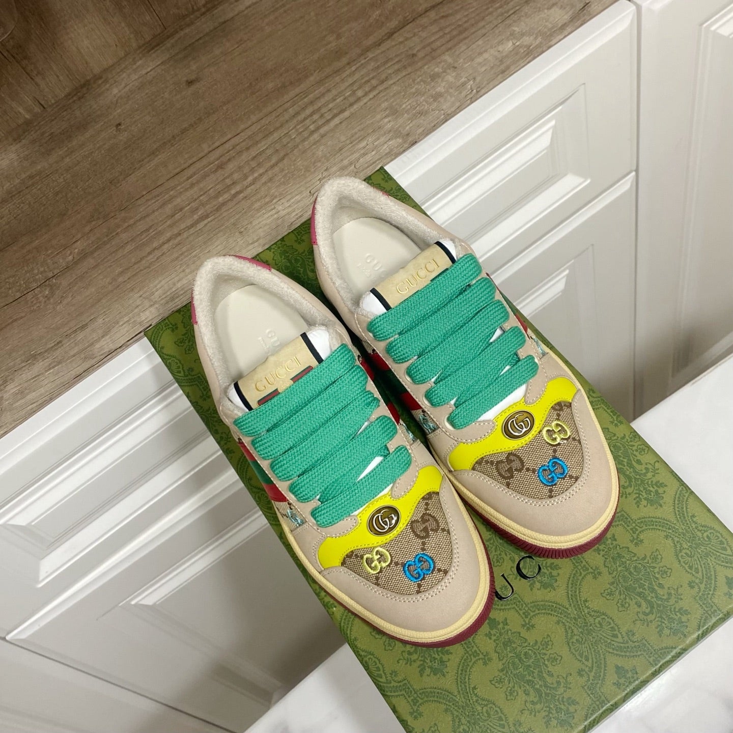 Gucci unisex sneakers, beige with teal-green laces and yellow toe, striped Gucci detail