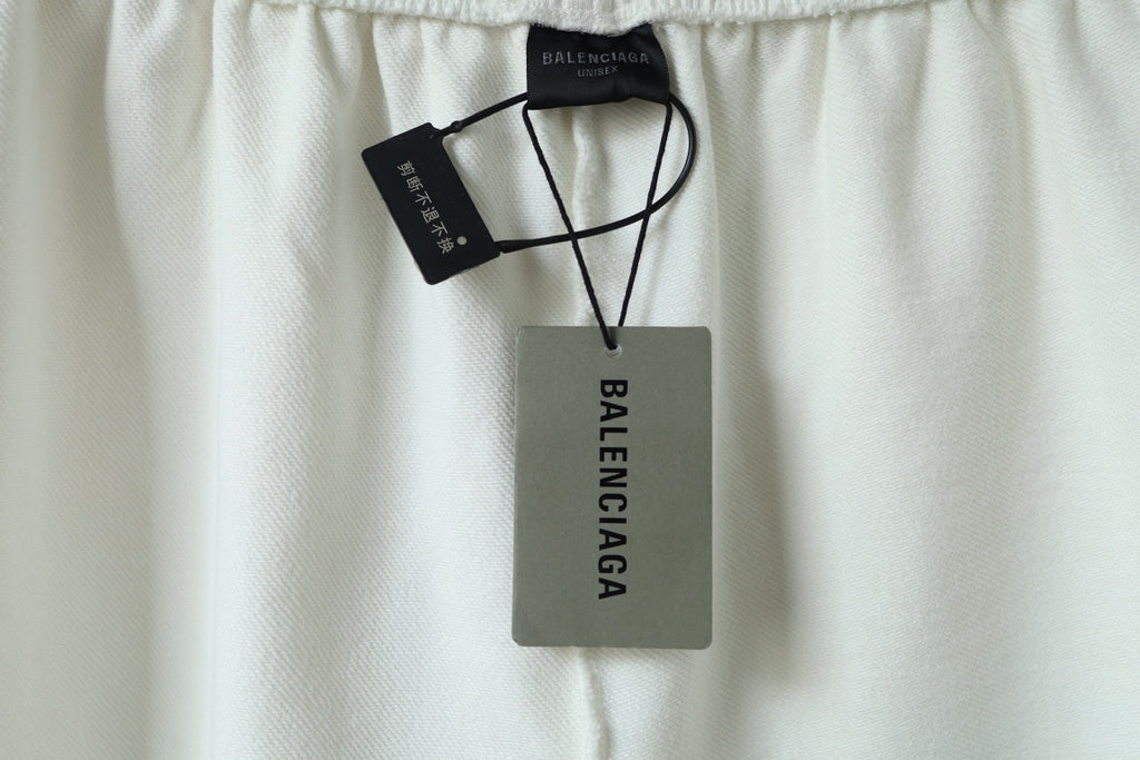 Balenciaga shorts with hang tags and elastic waistband shown at top