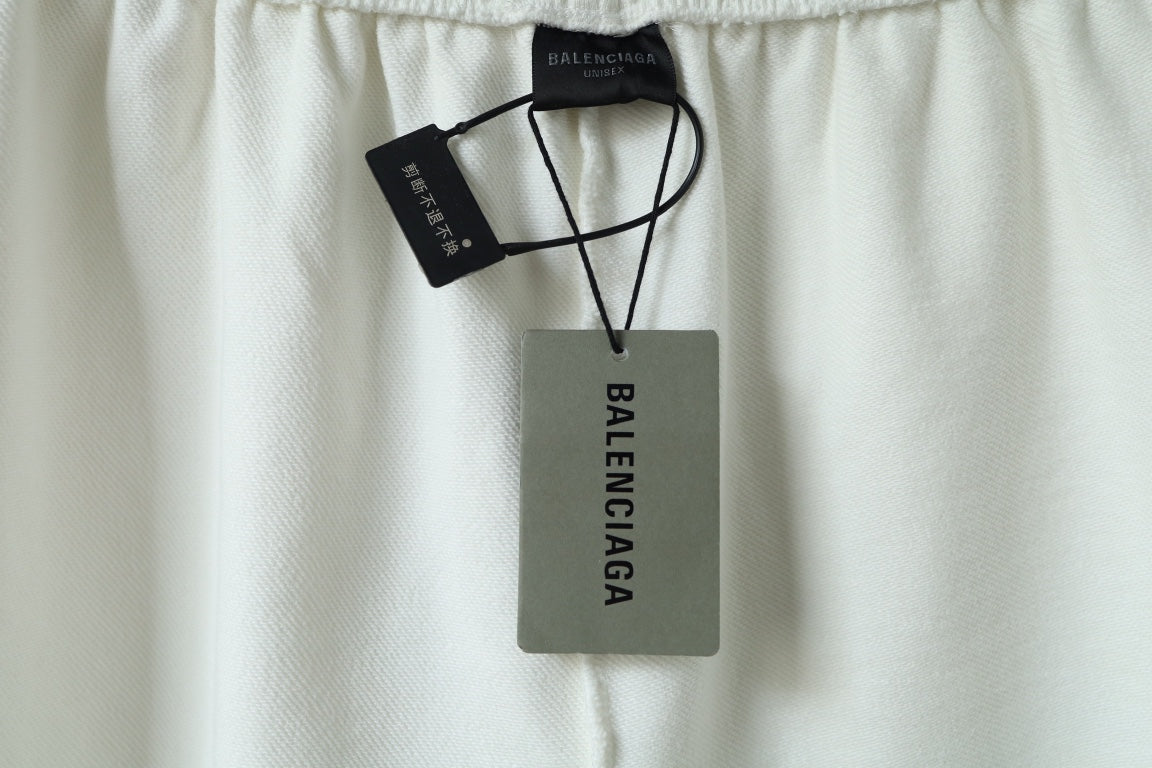 Balenciaga shorts with hang tags and elastic waistband shown at top