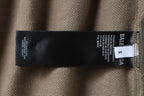 Balenciaga beige shorts care label with size and material details