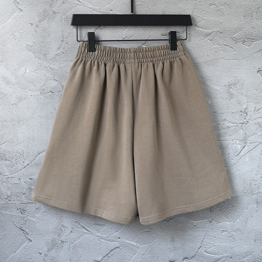 Balenciaga taupe cotton shorts with pleated front and elastic waist, laid flat