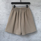 Balenciaga taupe cotton shorts with pleated front and elastic waist, laid flat