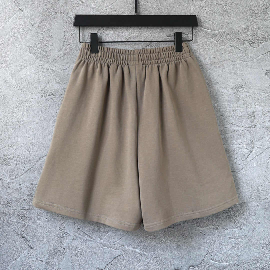 Balenciaga taupe cotton shorts with pleated front and elastic waist, laid flat