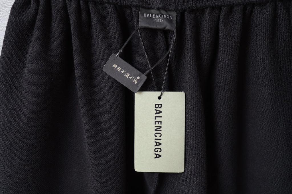 Balenciaga care label and swing tag on black shorts waistband