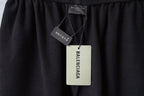Balenciaga care label and swing tag on black shorts waistband