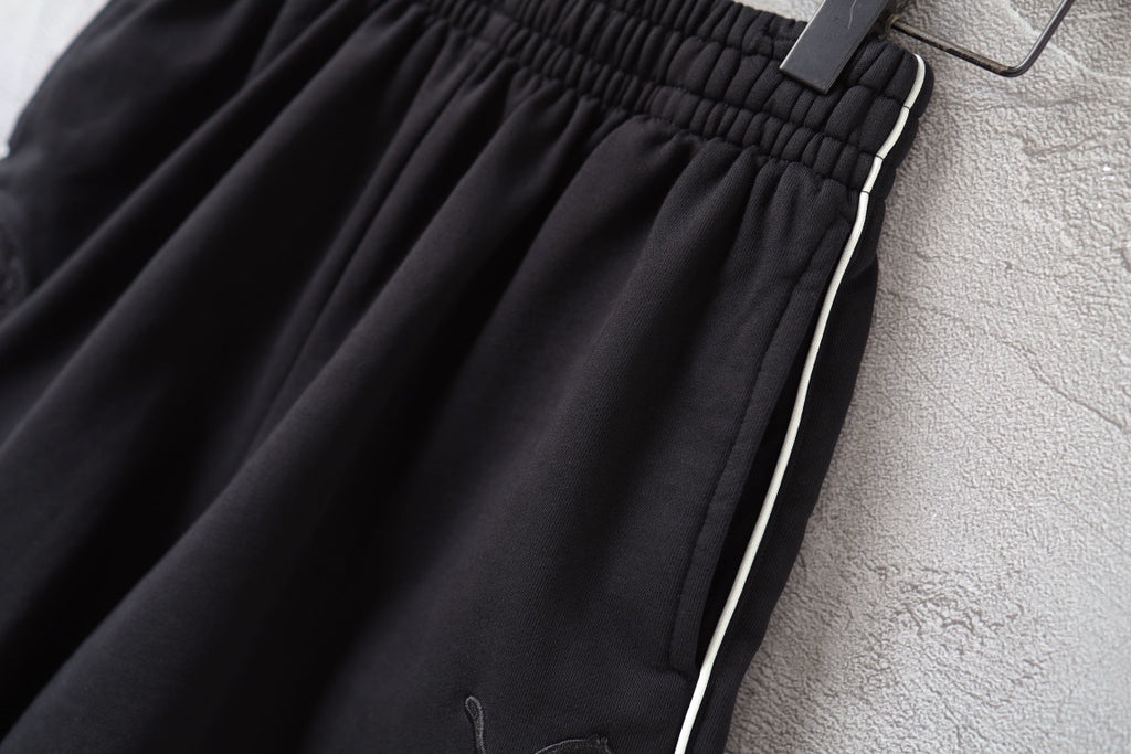 Black shorts with side stripe trim and elastic waistband