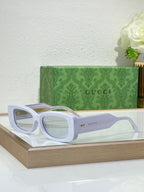 Gucci sunglasses with white frames and clear tinted lenses