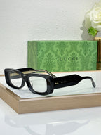 Gucci sunglasses with black frames and transparent light lenses