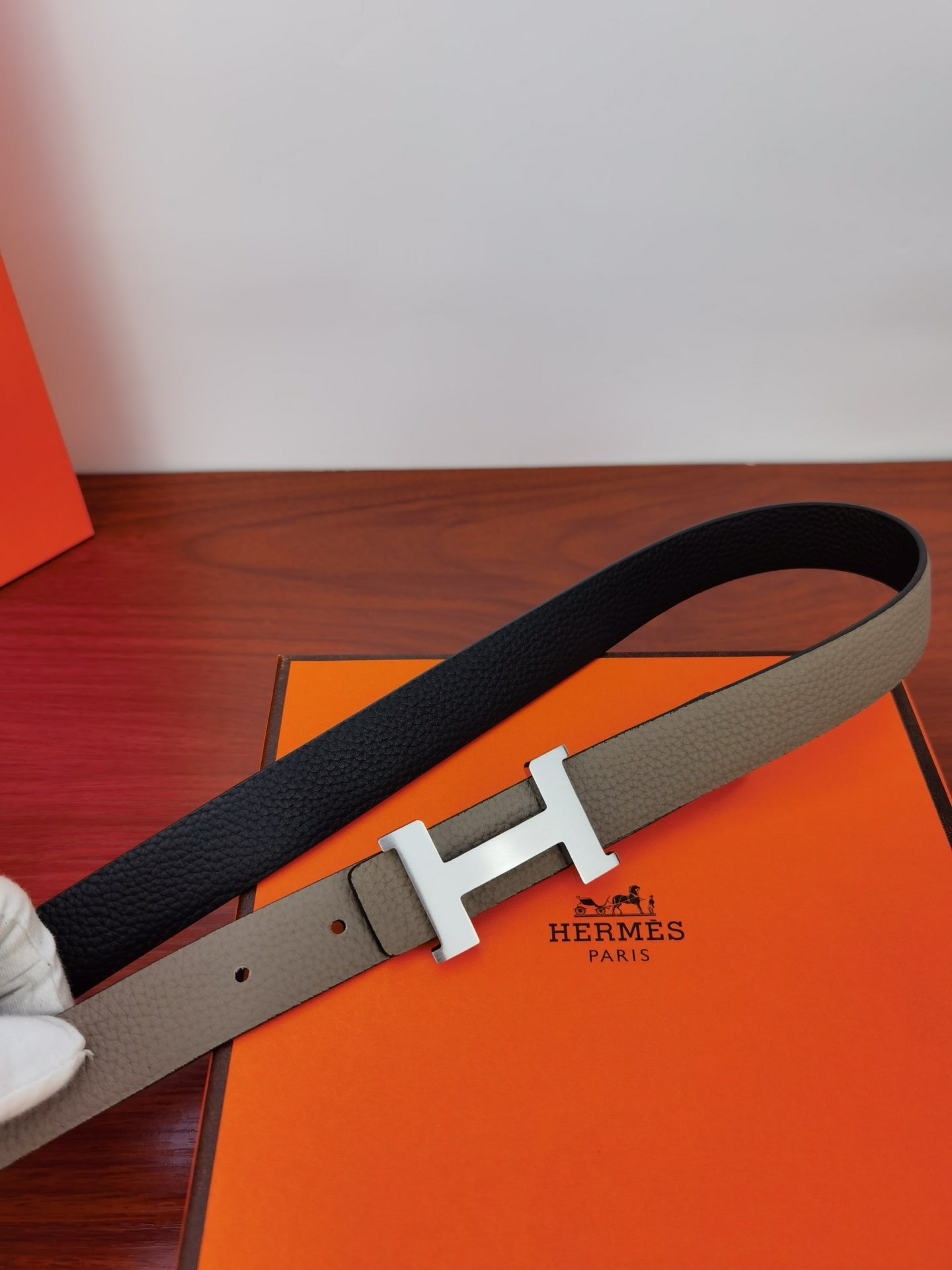 Hermes belt with dark strap and gold-tone H buckle