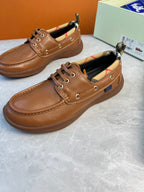 Burberry brown leather lace-up boat shoes with stitched seams and checkered inner collar